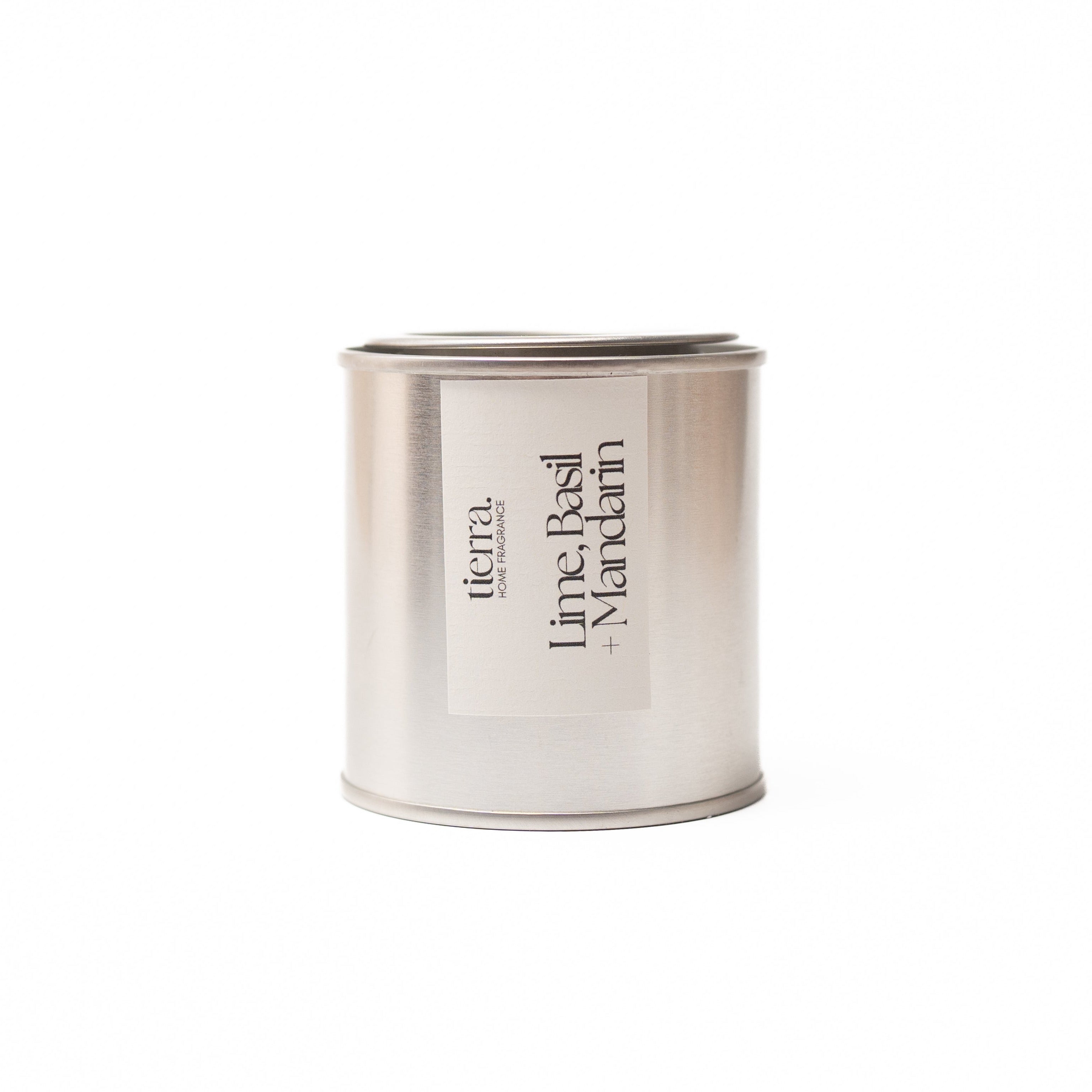 Lime Basil and Mandarin soy wax candle in silber mini tin on white background
